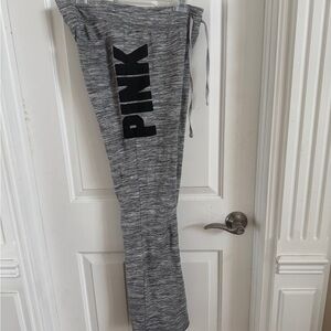 PINK jogger pants.  Black and white with emblems.  Medium